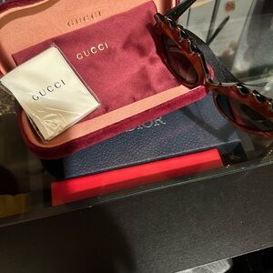 Authentic Gucci orange Sunglasses with Black and gold GG’s